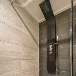 Installation of a hydromassage shower panel /electrical installation to the panel is not included/