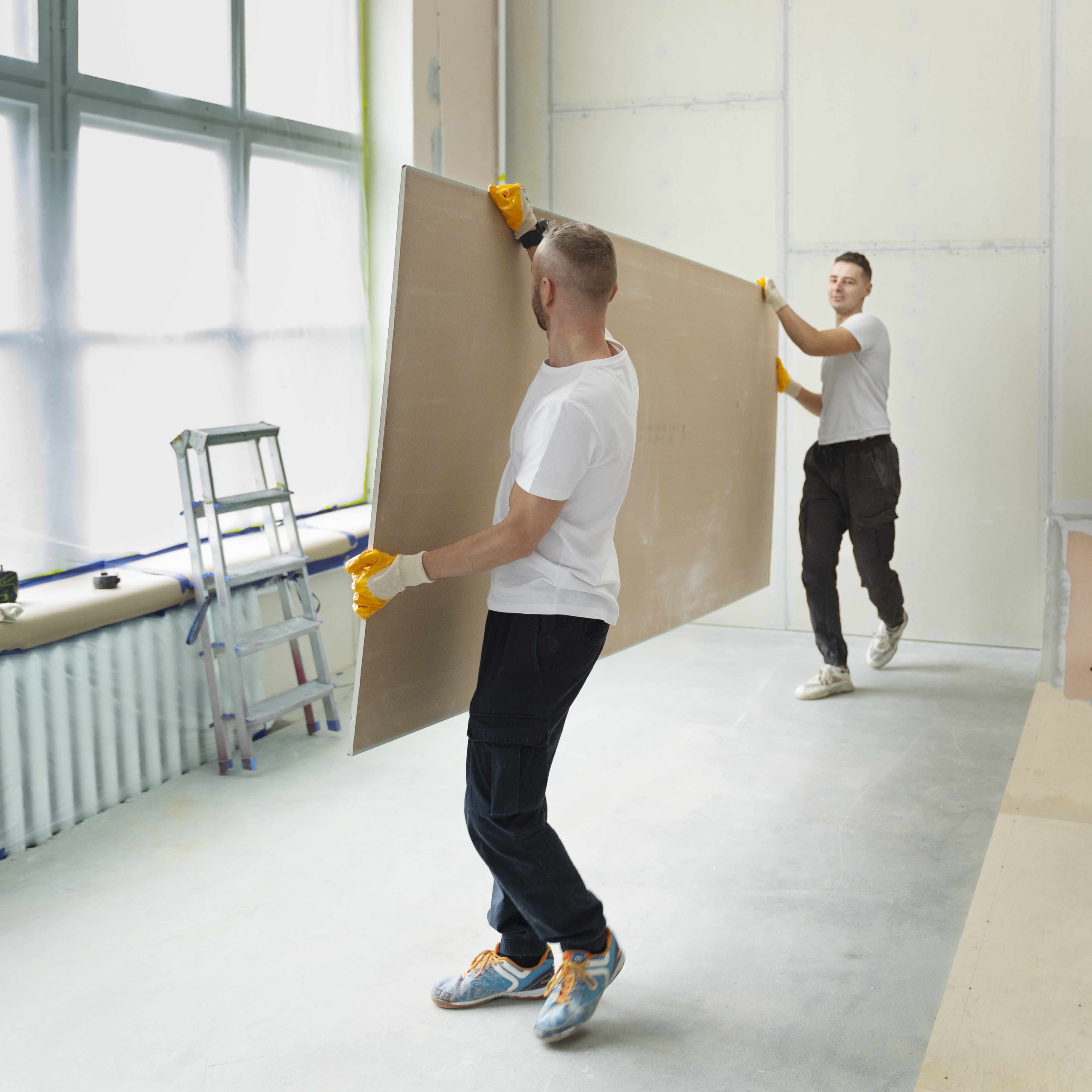 Gluing drywall to walls